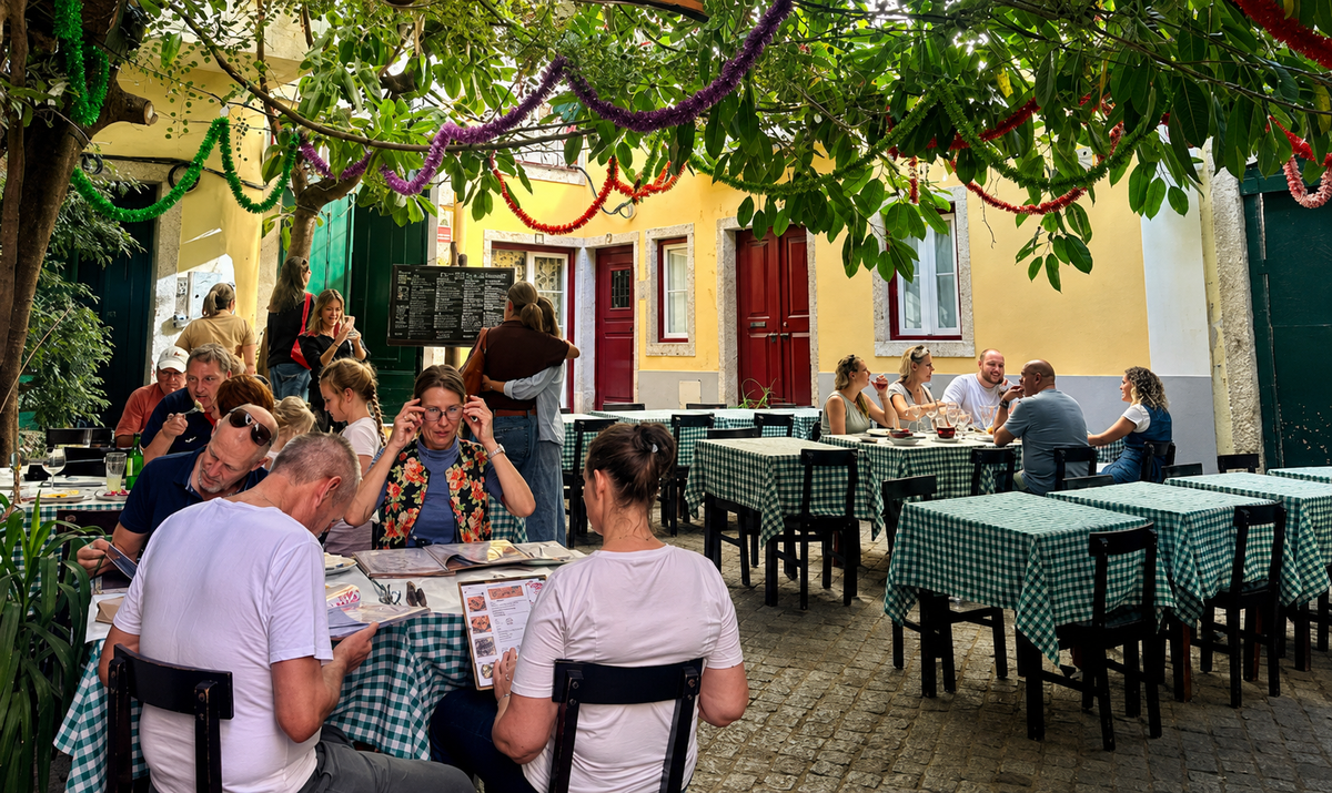 Tables in a leafy Lisbon neighbourhood setting
