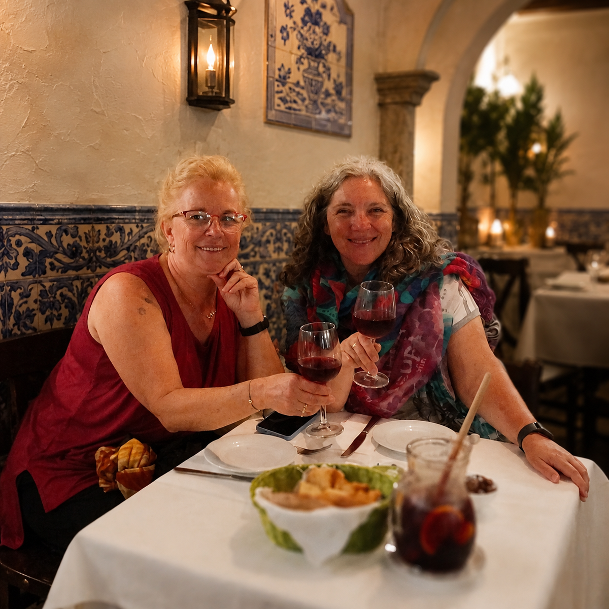 Guests enjoying dinner and wine in a Portuguese restaurant